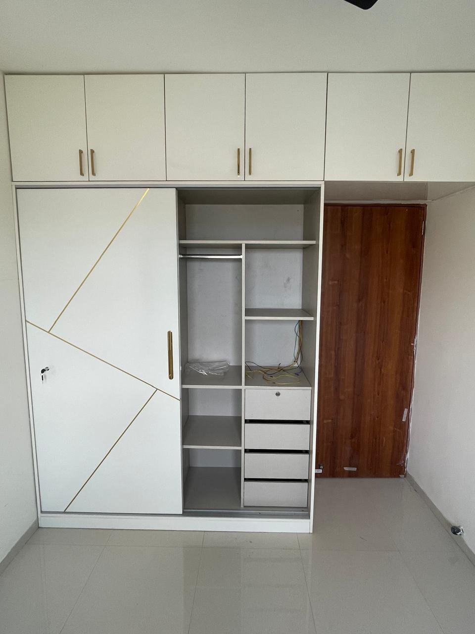 Modular wardrobe made by Encore Interiors in Dhanori, Pune